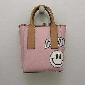 Beautiful pink Ganni smiley face bag.